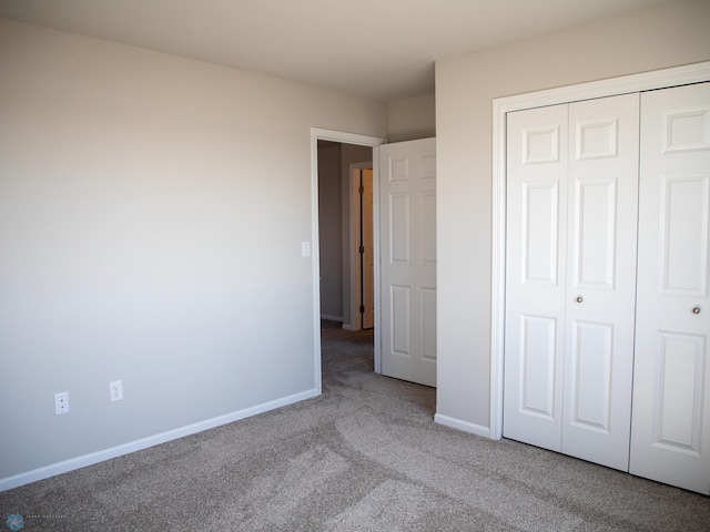 861 2nd Ave, Horace, ND 58047 - unfurnished bedroom with carpet flooring, baseboards, and a closet