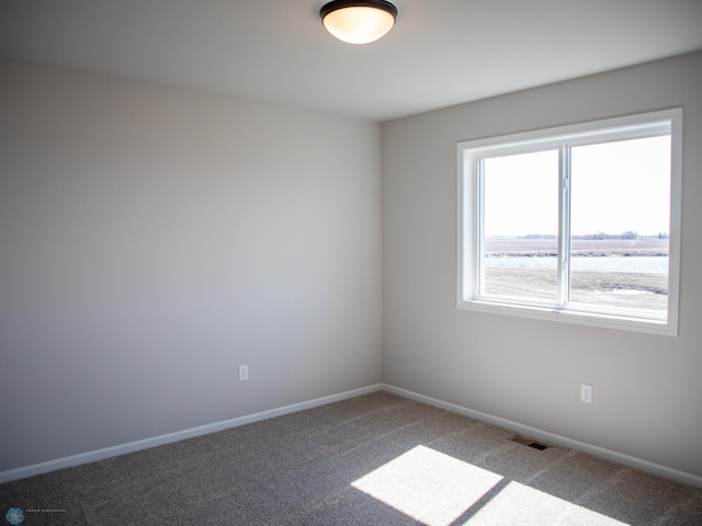 861 2nd Ave, Horace, ND 58047 - spare room featuring carpet and baseboards