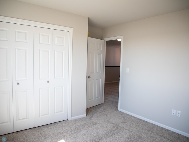 861 2nd Ave, Horace, ND 58047 - unfurnished bedroom featuring carpet, a closet, and baseboards