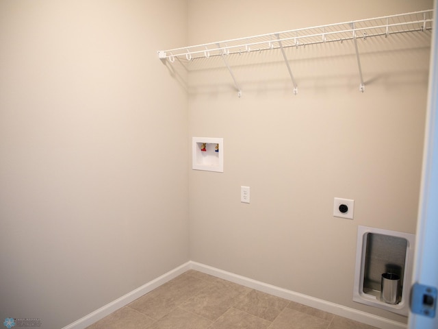 861 2nd Ave, Horace, ND 58047 - laundry area with hookup for a washing machine, baseboards, electric dryer hookup, and light tile patterned flooring
