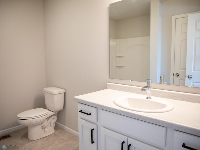 861 2nd Ave, Horace, ND 58047 - bathroom with vanity, baseboards, toilet, and tile patterned floors