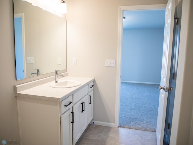861 2nd Ave, Horace, ND 58047 - bathroom featuring vanity, baseboards, and tile patterned flooring