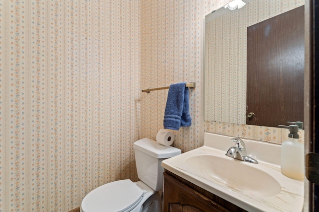 7508 Germane Trl Unit 0, Apple Valley, MN 55124 - half bath with wallpapered walls, vanity, and toilet