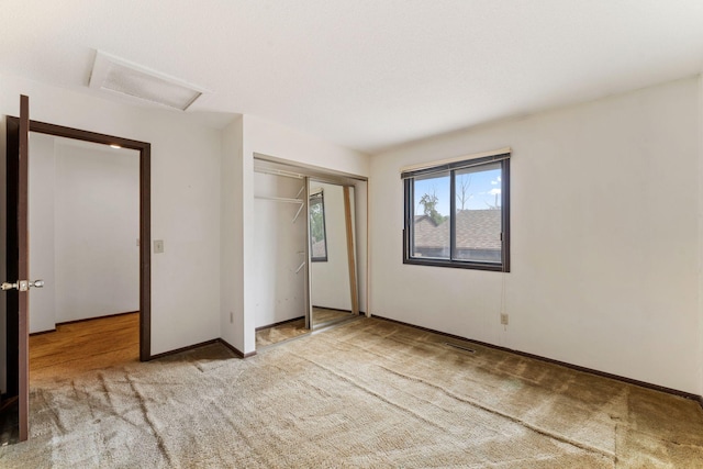 7508 Germane Trl Unit 0, Apple Valley, MN 55124 - unfurnished bedroom featuring attic access, carpet, a closet, and baseboards