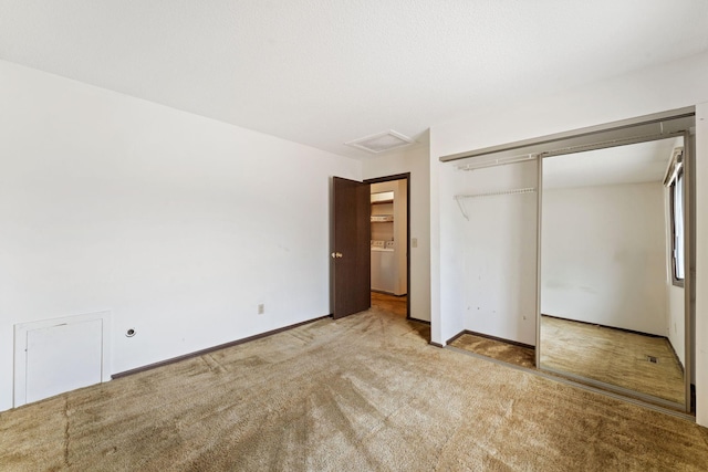 7508 Germane Trl Unit 0, Apple Valley, MN 55124 - unfurnished bedroom with carpet, a closet, washer / clothes dryer, attic access, and baseboards