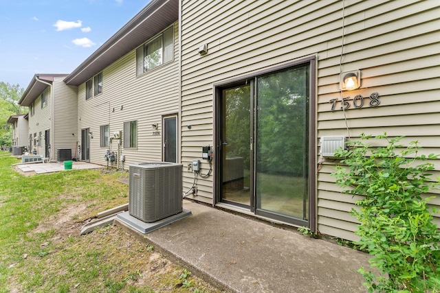 7508 Germane Trl Unit 0, Apple Valley, MN 55124 - back of property with central AC unit, a patio, and a yard