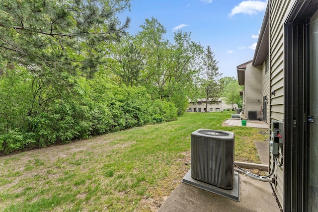 7508 Germane Trl Unit 0, Apple Valley, MN 55124 - view of grassy yard with central air condition unit and a patio