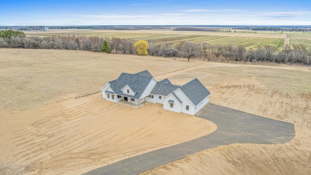 birds eye view of property with a rural view