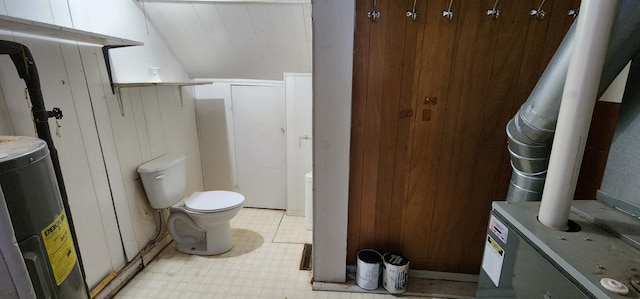 612 Mcpherson St, Littlefork, MN 56653 - bathroom featuring tile patterned floors, water heater, and toilet