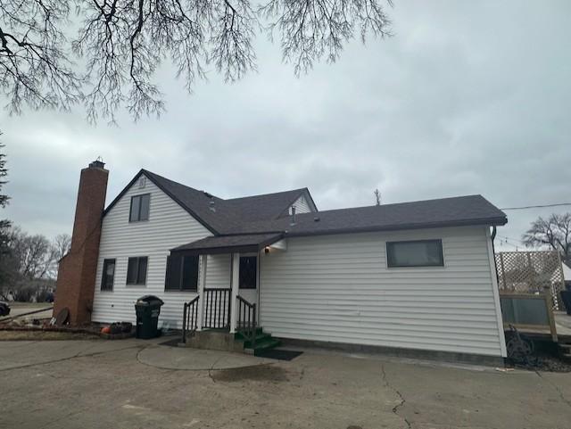 view of front of home with a chimney
