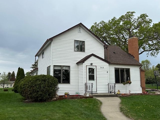 312 Melby Ave, Ashby, MN 56309 - view of front of house featuring a front yard and a chimney