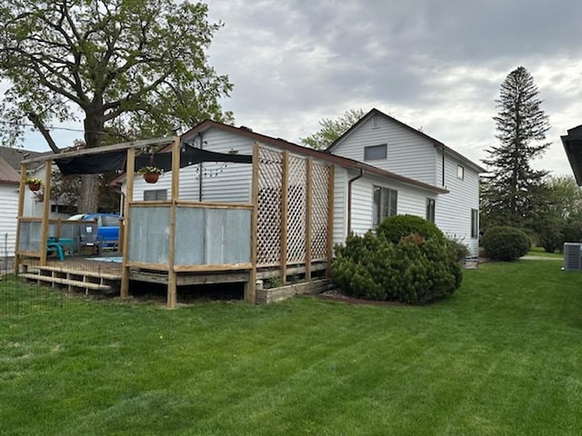 312 Melby Ave, Ashby, MN 56309 - view of side of property featuring a wooden deck, a lawn, and central AC unit