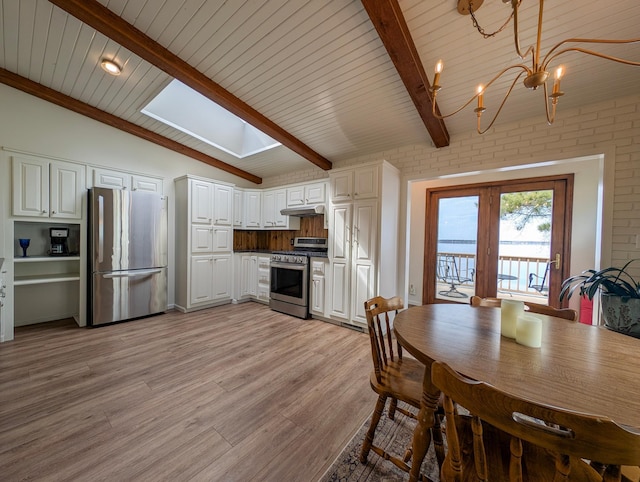 45257 Jack Pine Dr, Perham Twp, MN 56573 - dining room featuring light wood-type flooring, a chandelier, a skylight, and wood ceiling