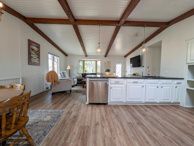 45257 Jack Pine Dr, Perham Twp, MN 56573 - kitchen featuring stainless steel dishwasher, light wood-style flooring, open floor plan, dark countertops, and a sink
