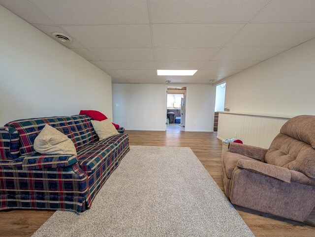 45257 Jack Pine Dr, Perham Twp, MN 56573 - living room with a drop ceiling, wood finished floors, and baseboards