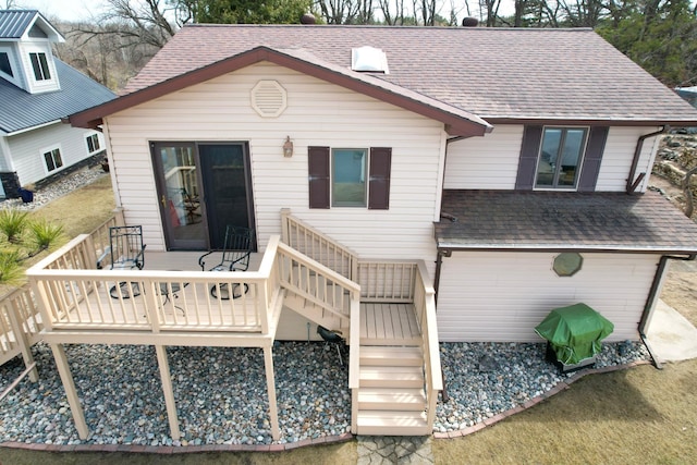 45257 Jack Pine Dr, Perham Twp, MN 56573 - back of house featuring a shingled roof, a wooden deck, and stairway