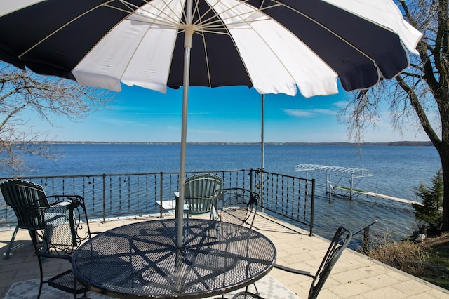 45257 Jack Pine Dr, Perham Twp, MN 56573 - view of patio / terrace with a water view and outdoor dining area