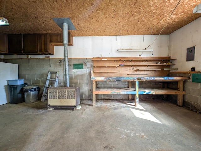 45257 Jack Pine Dr, Perham Twp, MN 56573 - below grade area with a workshop area, concrete block wall, and electric panel
