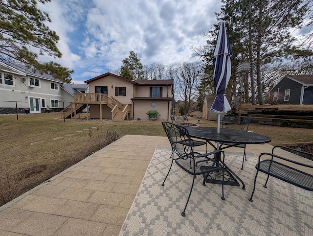 45257 Jack Pine Dr, Perham Twp, MN 56573 - view of patio / terrace with stairway, a deck, and outdoor dining space