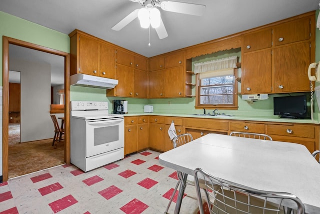 kitchen with a ceiling fan, light floors, light countertops, electric range, and under cabinet range hood