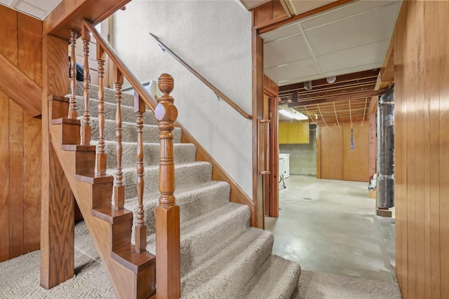 15881 Rush Creek Rd, Dayton, MN 55369 - stairway with concrete floors and wood walls