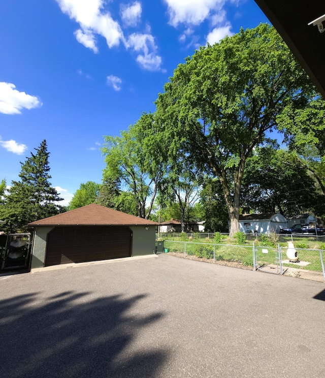 719 49th Ave NE, Columbia Heights, MN 55421 - view of front facade with a detached garage and an outdoor structure