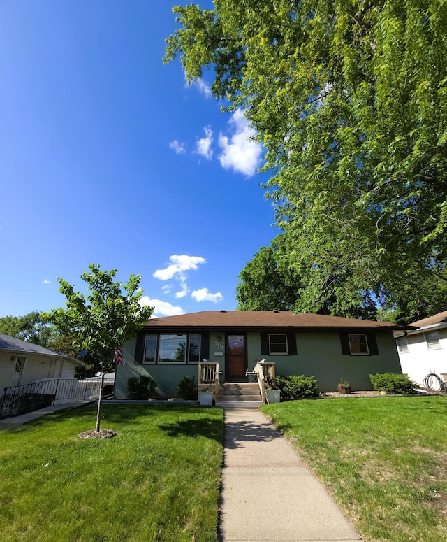 719 49th Ave NE, Columbia Heights, MN 55421 - ranch-style home with a front yard and stucco siding