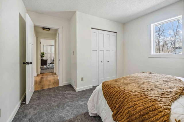 14347 Memorywood Dr, Baxter, MN 56425 - bedroom with baseboards, a textured ceiling, a closet, and carpet flooring
