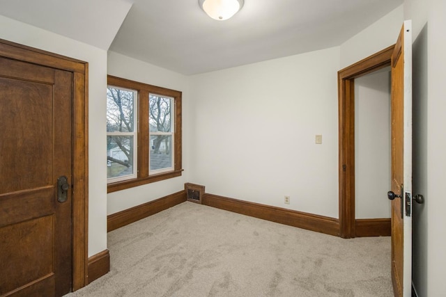 unfurnished bedroom with visible vents, baseboards, and carpet floors