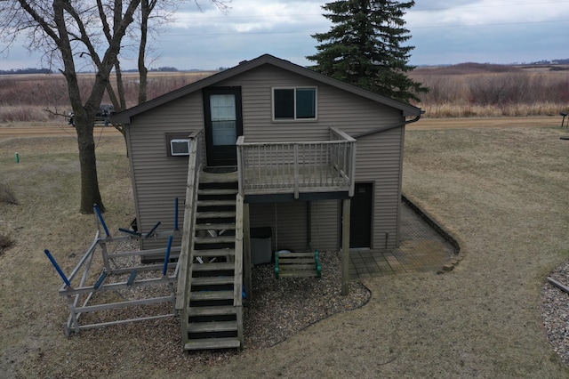 7030 147th Ave SE, Lake Lillian, MN 56253 - back of house with stairway and a deck