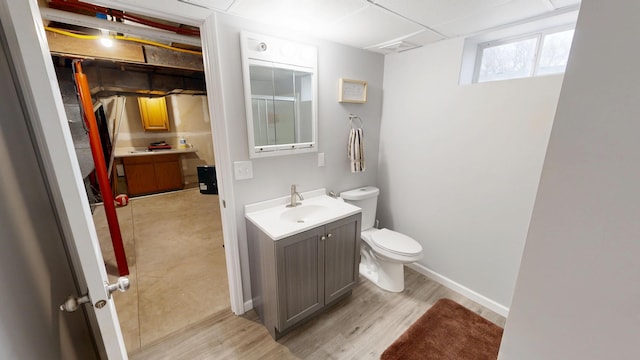 7030 147th Ave SE, Lake Lillian, MN 56253 - bathroom with toilet, wood finished floors, and vanity