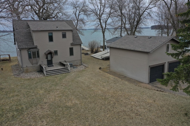 7030 147th Ave SE, Lake Lillian, MN 56253 - rear view of property with a water view, a yard, and a shingled roof
