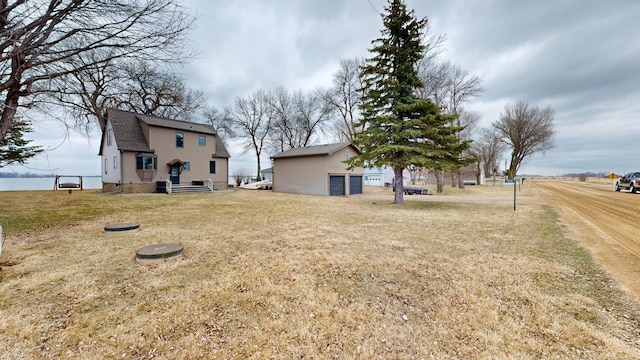 7030 147th Ave SE, Lake Lillian, MN 56253 - view of grassy yard with a garage
