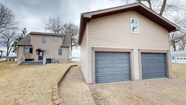7030 147th Ave SE, Lake Lillian, MN 56253 - rear view of property featuring dirt driveway and a garage