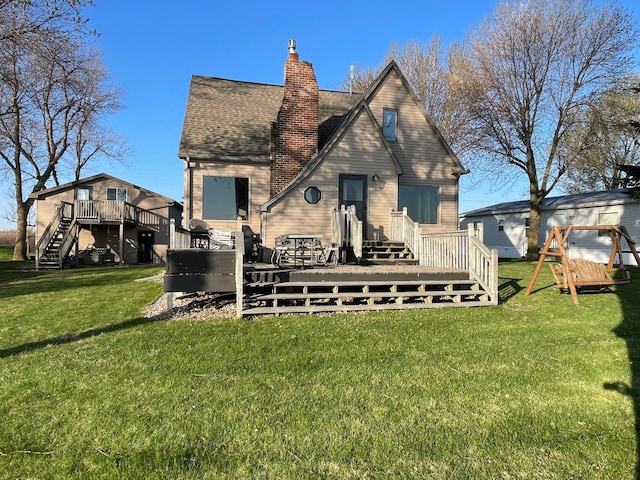 7030 147th Ave SE, Lake Lillian, MN 56253 - back of property with a wooden deck, a chimney, a yard, and stairs