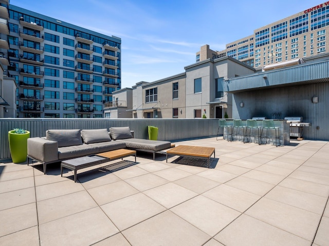 view of patio / terrace featuring an outdoor living space and a grill