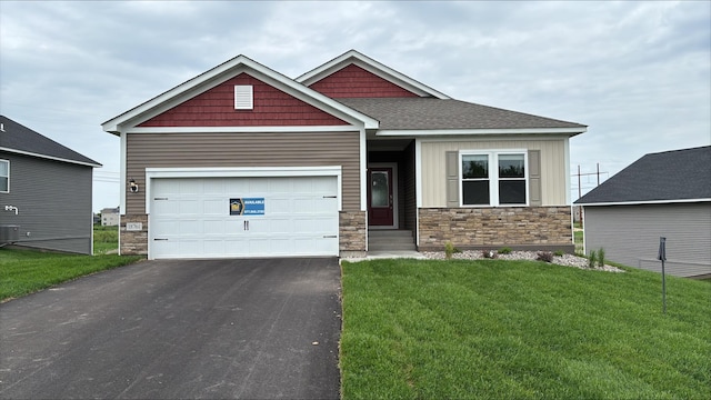 18761 Grant St NW, Elk River, MN 55330 - craftsman inspired home featuring stone siding, asphalt driveway, and a front yard