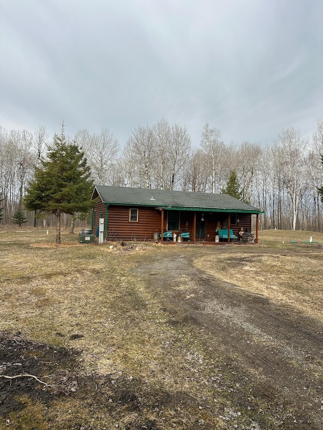 exterior space featuring faux log siding