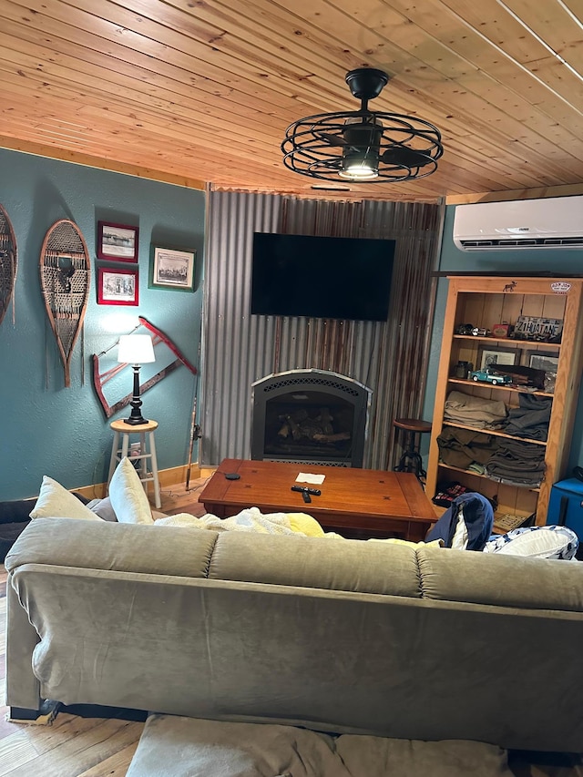 living room featuring a wall unit AC, a ceiling fan, wood finished floors, wood ceiling, and a fireplace