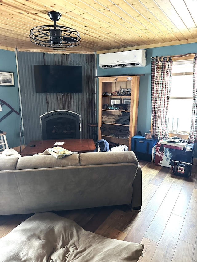 living room featuring wood-type flooring, a wall mounted air conditioner, a fireplace, and wooden ceiling