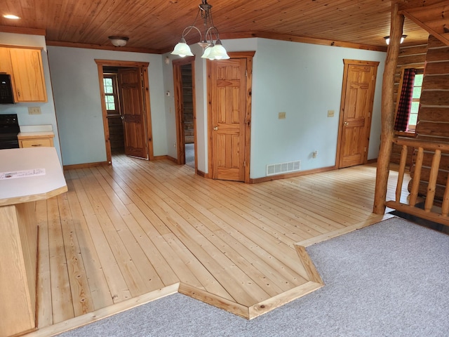 21339 Finch Dr, Park Rapids, MN 56470 - unfurnished dining area with baseboards, light wood-type flooring, wood ceiling, and crown molding