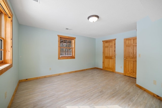21339 Finch Dr, Park Rapids, MN 56470 - spare room featuring light wood-style flooring and baseboards