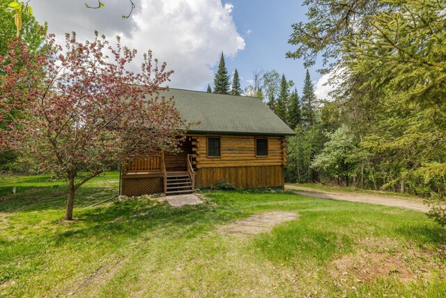 21339 Finch Dr, Park Rapids, MN 56470 - log home with log exterior, a deck, and a front yard