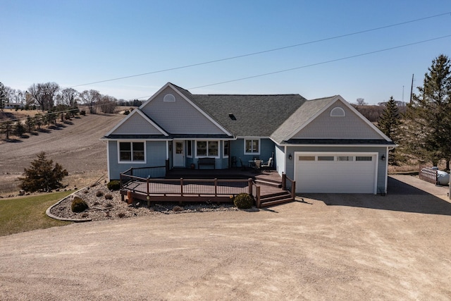 3195 115th St NW, Oronoco, MN 55960 - view of front of home with dirt driveway, an attached garage, and a wooden deck