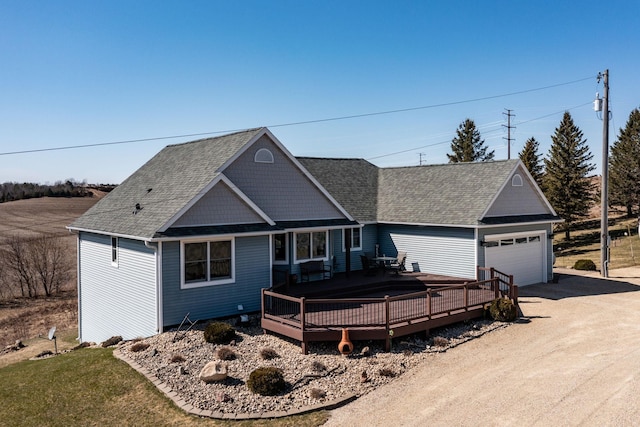 3195 115th St NW, Oronoco, MN 55960 - view of front of home with a deck, an attached garage, driveway, and a shingled roof