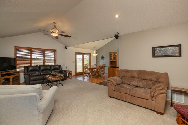 3195 115th St NW, Oronoco, MN 55960 - living room with lofted ceiling, a ceiling fan, carpet flooring, and recessed lighting