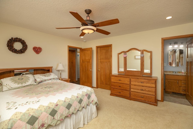 3195 115th St NW, Oronoco, MN 55960 - bedroom with light carpet, recessed lighting, ensuite bath, a ceiling fan, and a textured ceiling