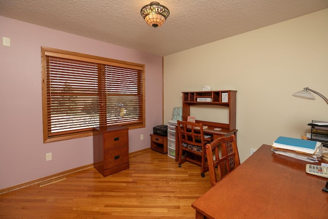 3195 115th St NW, Oronoco, MN 55960 - office area with light wood-style floors, baseboards, and a textured ceiling