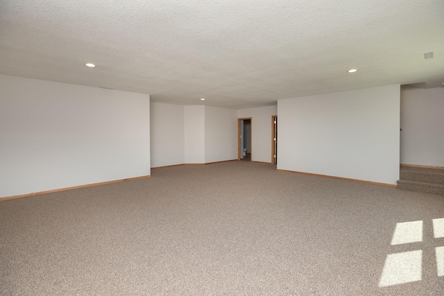 3195 115th St NW, Oronoco, MN 55960 - carpeted spare room with recessed lighting, a textured ceiling, and baseboards