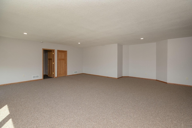 3195 115th St NW, Oronoco, MN 55960 - carpeted spare room with recessed lighting, a textured ceiling, and baseboards